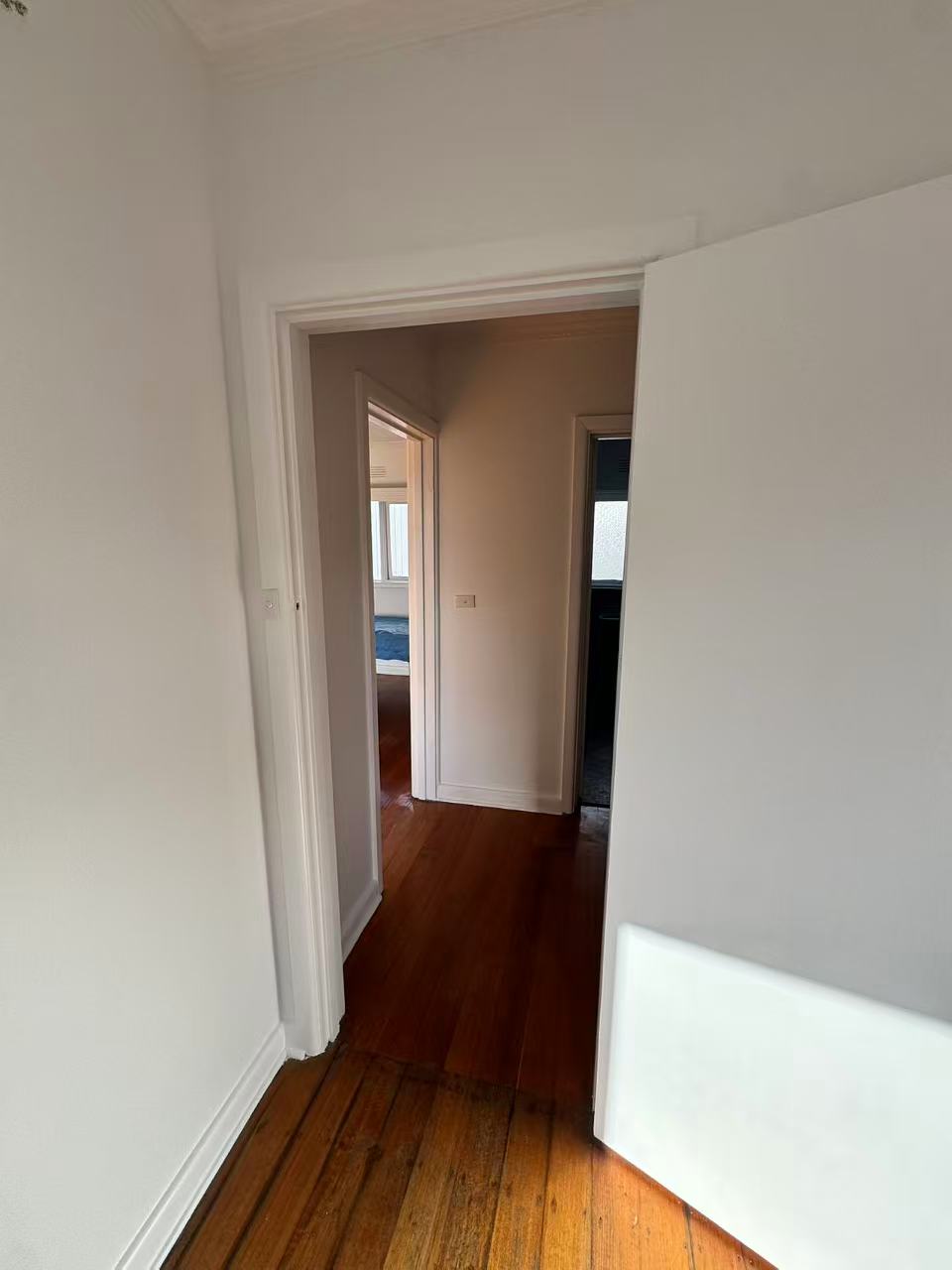 White interior door and hallway frame
