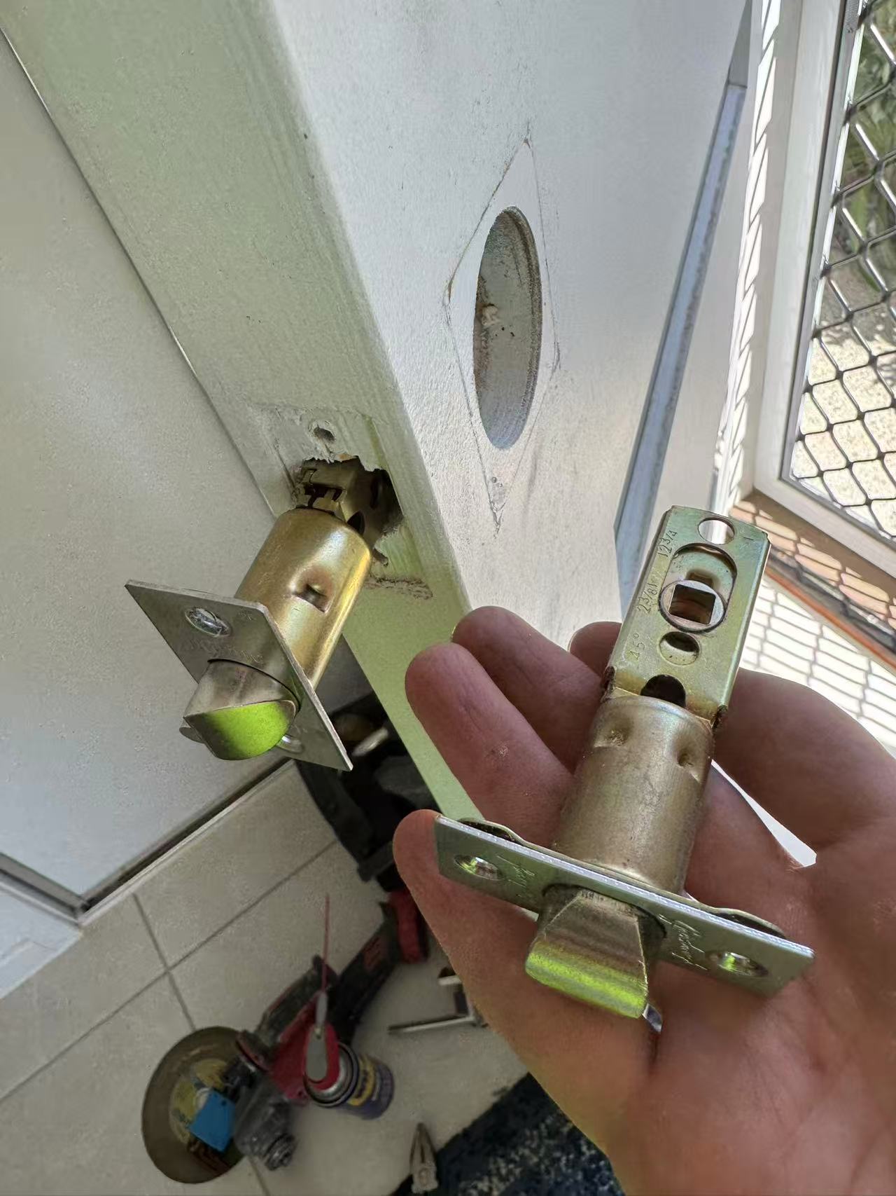Existing door edge beside latch components