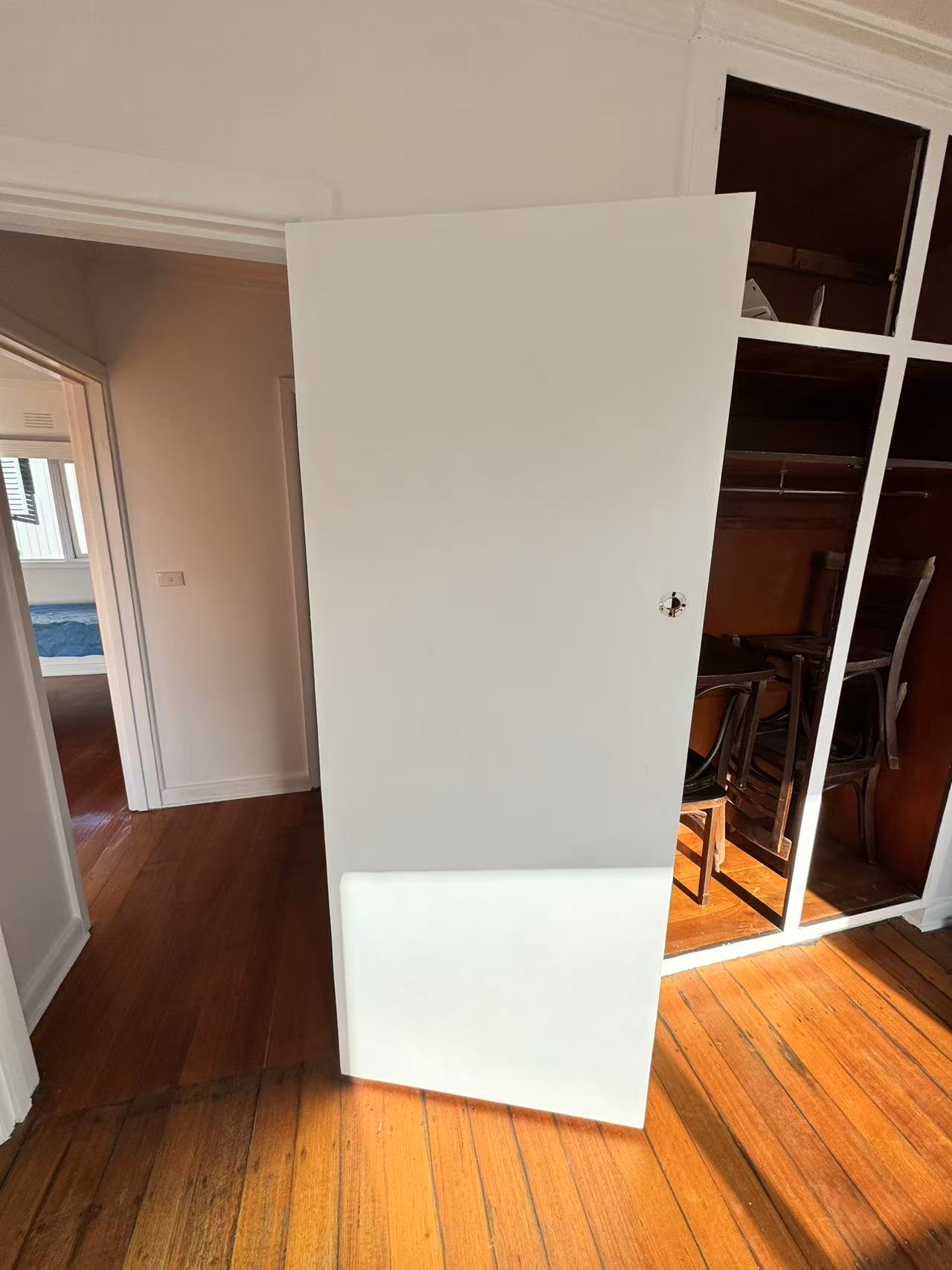 White door panel with lock hardware opening