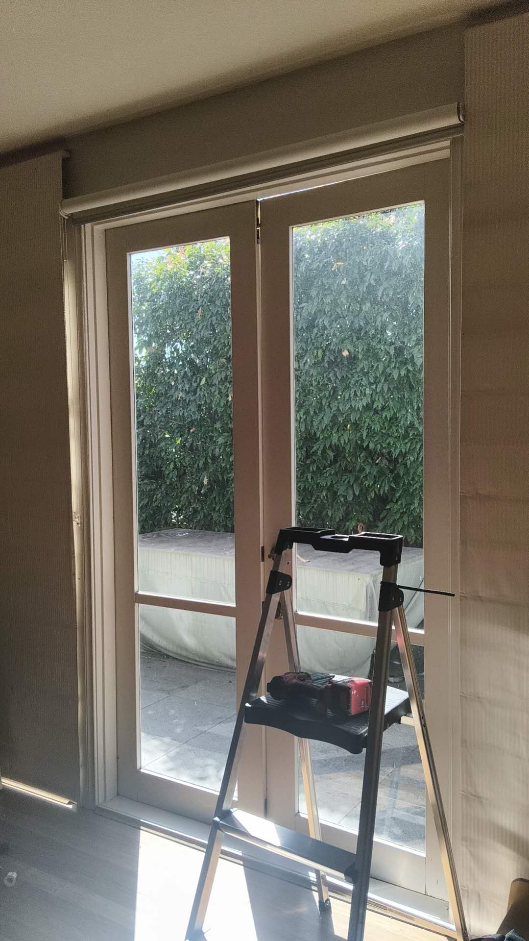 Full view of a glazed door and frame during work