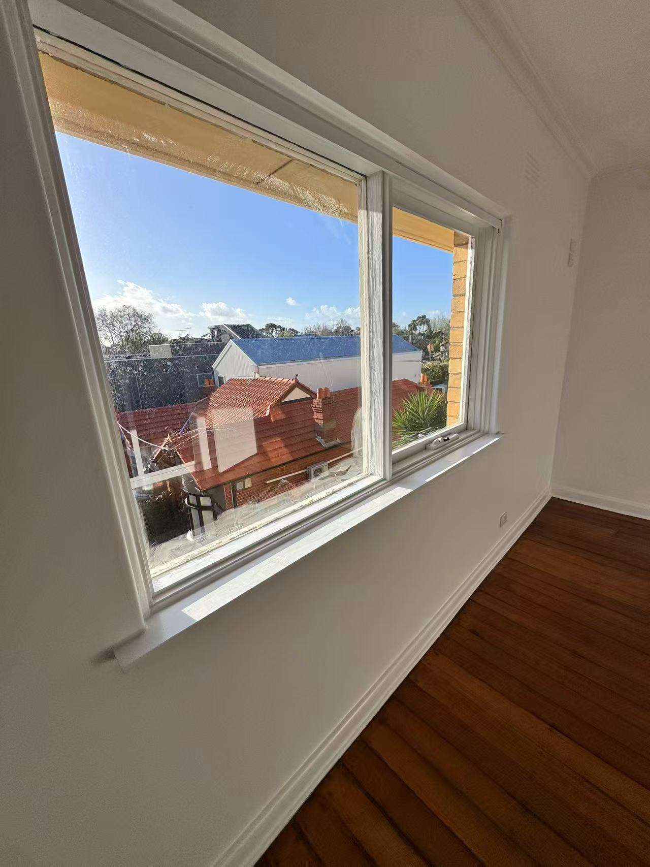 Close view of white window frame and sill